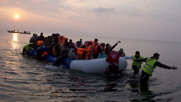 In this Sunday, March 20, 2016 file photo, volunteers help migrants and refugees on a dingy as they arrive at the shore of the northeastern Greek island of Lesbos, after crossing the Aegean sea from Turkey. In this Sunday, March 20, 2016 file photo, volunteers help migrants and refugees on a dingy as they arrive at the shore of the northeastern Greek island of Lesbos, after crossing the Aegean sea from Turkey. - Sputnik International