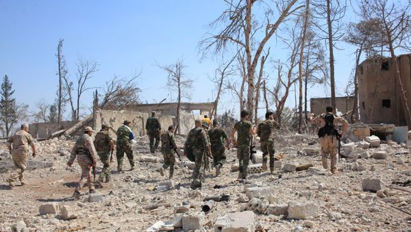 Forces loyal to Syria's President Bashar al-Assad walk at a military complex, after they recaptured areas in southwestern Aleppo that rebels had seized last month, Syria, in this handout picture provided by SANA on September 5, 2016. - Sputnik International