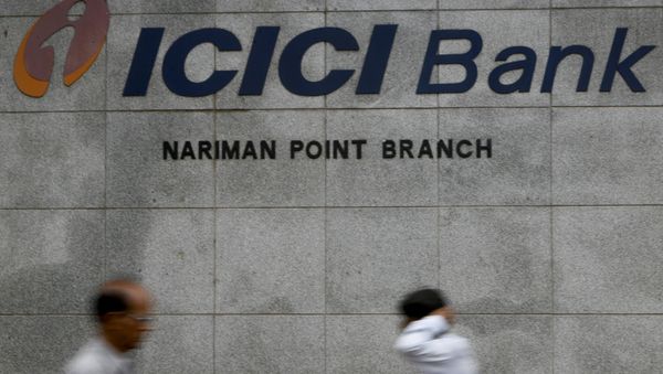 Pedestrians walking outside the ICICI bank in Mumbai, India. (File) Pedestrians walking outside the ICICI bank in Mumbai, India. (File) - Sputnik International