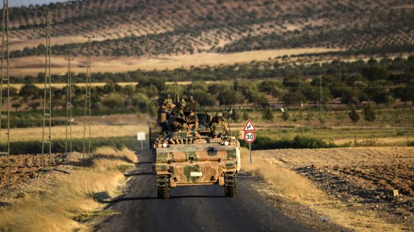 Turkish soldiers stand in a Turkish army tank driving back to Turkey from the Syrian-Turkish border town of Jarabulus on September in the Turkish-Syrian border town of Karkamis. (File) Turkish soldiers stand in a Turkish army tank driving back to Turkey from the Syrian-Turkish border town of Jarabulus on September in the Turkish-Syrian border town of Karkamis. (File) - Sputnik International