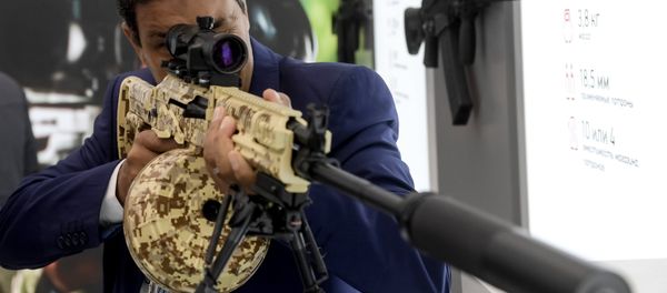 A visitor reviews an RPK-16 light machine rifle at the Kalashnikov pavilion, at the ARMY 2016 International Military Forum, at the exhibition center of the Patriot Military Park of the Russian Armed Forces in the Moscow Region. A visitor reviews an RPK-16 light machine rifle at the Kalashnikov pavilion, at the ARMY 2016 International Military Forum, at the exhibition center of the Patriot Military Park of the Russian Armed Forces in the Moscow Region. - Sputnik International