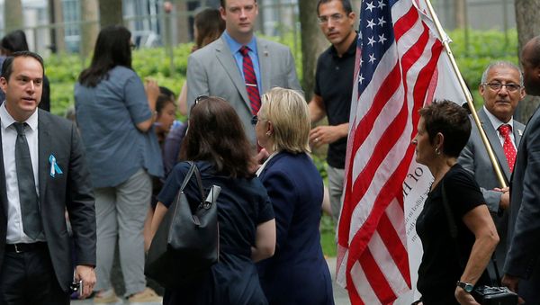 US Democratic presidential candidate Hillary Clinton leaves ceremonies marking the 15th anniversary of the September 11 attacks at the National 9/11 Memorial in New York, New York, United States September 11, 2016. US Democratic presidential candidate Hillary Clinton leaves ceremonies marking the 15th anniversary of the September 11 attacks at the National 9/11 Memorial in New York, New York, United States September 11, 2016. - Sputnik International