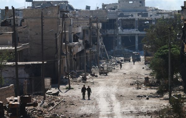 Syrian pro-regime fighters walk in a bombed-out steet in Ramussa on September 9, 2016, after they took control of the strategically important district on the outskirts of the Syrian city of Aleppo yesterday Syrian pro-regime fighters walk in a bombed-out steet in Ramussa on September 9, 2016, after they took control of the strategically important district on the outskirts of the Syrian city of Aleppo yesterday - Sputnik International