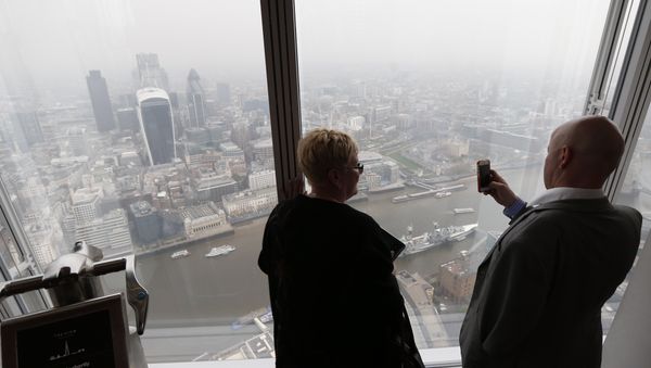 A man takes a picture of London's skyline from the viewing platform of a skyscraper in central London, Thursday, April 3, 2014 A man takes a picture of London's skyline from the viewing platform of a skyscraper in central London, Thursday, April 3, 2014 - Sputnik International
