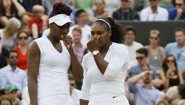Serena Williams, right with her sister and playing partner Venus Williams of the US talks as they play against Elena Vesnina of Russia and Ekaterina Makarova of Russia during their women's doubles tennis match on eleven day of the Wimbledon Tennis Championships in London, Thursday, July 7, 2016 Serena Williams, right with her sister and playing partner Venus Williams of the US talks as they play against Elena Vesnina of Russia and Ekaterina Makarova of Russia during their women's doubles tennis match on eleven day of the Wimbledon Tennis Championships in London, Thursday, July 7, 2016 - Sputnik International