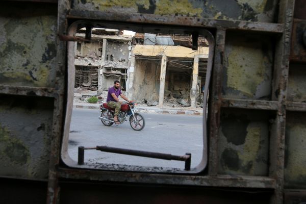 A man rides a motocycle near damaged buildings in the rebel held Old Aleppo, Syria, September 14, 2016 A man rides a motocycle near damaged buildings in the rebel held Old Aleppo, Syria, September 14, 2016 - Sputnik International