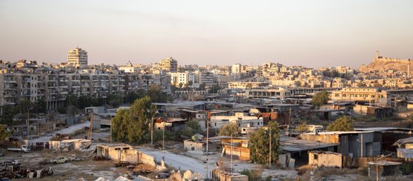 A picture taken on July 29, 2016 shows a general view of Karaj al-Hajz corridor (C) in the rebel-held part of Aleppo, leading towards the government controlled area of the Masharqa neighbourhood (background) A picture taken on July 29, 2016 shows a general view of Karaj al-Hajz corridor (C) in the rebel-held part of Aleppo, leading towards the government controlled area of the Masharqa neighbourhood (background) - Sputnik International
