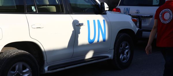 Vehicles of a UN and SARC aid convoy, with food, nutrition, health and other emergency items, enter the rebel-held town of Douma, east of the Syrian capital Damascus, on June 10, 2016 Vehicles of a UN and SARC aid convoy, with food, nutrition, health and other emergency items, enter the rebel-held town of Douma, east of the Syrian capital Damascus, on June 10, 2016 - Sputnik International