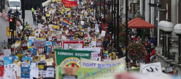 Demonstrators take part in a march calling for the British parliament to welcome refugees in the UK in central London Demonstrators take part in a march calling for the British parliament to welcome refugees in the UK in central London - Sputnik International