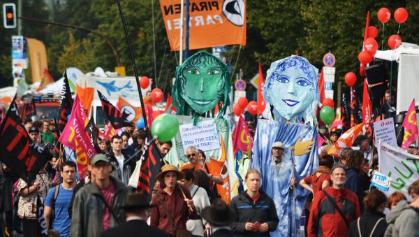 Rights activists take part in a march to protest against the Transatlantic Trade and Investment Partnership (TTIP) and Comprehensive Economic and Trade Agreement (CETA) in Berlin, Germany - Sputnik International
