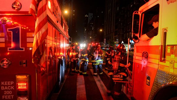 New York City firefighters stand near the site of an explosion in the Chelsea neighborhood of Manhattan, New York - Sputnik International