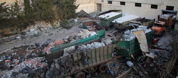 Aid is seen strewn across the floor in the town of Orum al-Kubra on the western outskirts of the northern Syrian city of Aleppo on September 20, 2016, the morning after a convoy delivering aid was hit by a deadly air strike. Aid is seen strewn across the floor in the town of Orum al-Kubra on the western outskirts of the northern Syrian city of Aleppo on September 20, 2016, the morning after a convoy delivering aid was hit by a deadly air strike. - Sputnik International