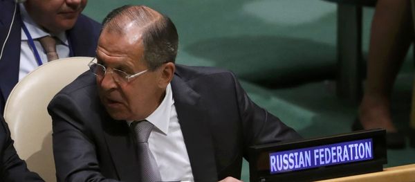 Russian Foreign Minister Sergei Lavrov confers with members of his delegation as U.S. President Barack Obama speaks during the 71st United Nations General Assembly in Manhattan, New York, U.S - Sputnik International