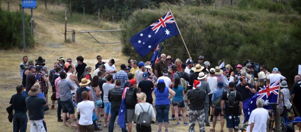 Protesters fly an Australian flag at a halal-free barbecue held by anti-Islam protesters at Cronulla beach in southern Sydney (File) Protesters fly an Australian flag at a halal-free barbecue held by anti-Islam protesters at Cronulla beach in southern Sydney (File) - Sputnik International