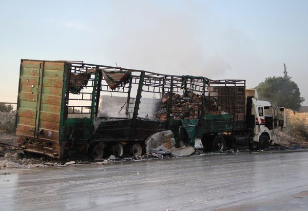 A damaged truck carrying aid is seen on the side of the road in the town of Orum al-Kubra on the western outskirts of the northern Syrian city of Aleppo on September 20, 2016, the morning after a convoy delivering aid was hit by a deadly air strike A damaged truck carrying aid is seen on the side of the road in the town of Orum al-Kubra on the western outskirts of the northern Syrian city of Aleppo on September 20, 2016, the morning after a convoy delivering aid was hit by a deadly air strike - Sputnik International