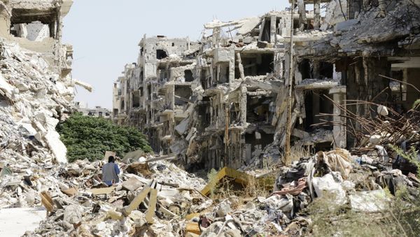 A general view shows destroyed buildings in the government-held Jouret al-Shiah neighbourhood of the central Syrian city of Homs on September 19, 2016 A general view shows destroyed buildings in the government-held Jouret al-Shiah neighbourhood of the central Syrian city of Homs on September 19, 2016 - Sputnik International
