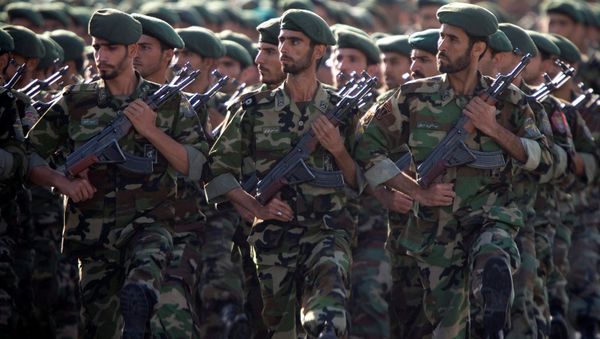 Members of Iran's Revolutionary Guards march during a military parade to commemorate the 1980-88 Iran-Iraq war in Tehran. Members of Iran's Revolutionary Guards march during a military parade to commemorate the 1980-88 Iran-Iraq war in Tehran. - Sputnik International