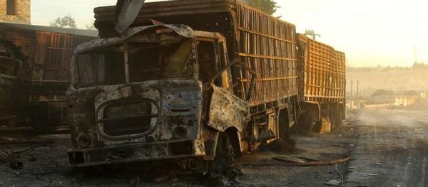 Damaged aid trucks are pictured after an airstrike on the rebel held Urm al-Kubra town, western Aleppo city, Syria September 20, 2016 - Sputnik International