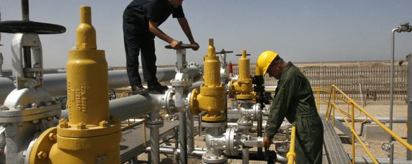 Iranian oil technician, right, and coworker work at the oil separator facilities in Azadegan oil field, some 480 miles (800 kilometers) southwest of the capital, Tehran, Iran Iranian oil technician, right, and coworker work at the oil separator facilities in Azadegan oil field, some 480 miles (800 kilometers) southwest of the capital, Tehran, Iran - Sputnik International