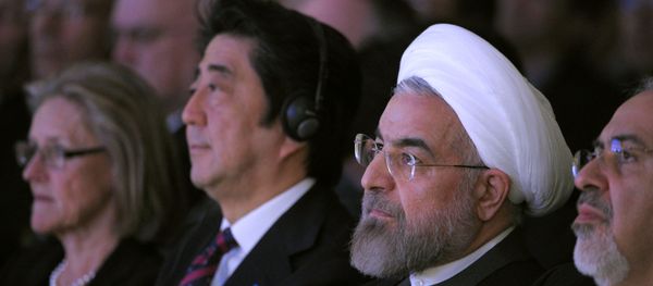 Iranian President Hassan Rouhani (R) sits next to Japanese Prime Minister Shinzo Abe (L) during the opening session of the World Economic Forum in Davos on January 22, 2014 Iranian President Hassan Rouhani (R) sits next to Japanese Prime Minister Shinzo Abe (L) during the opening session of the World Economic Forum in Davos on January 22, 2014 - Sputnik International