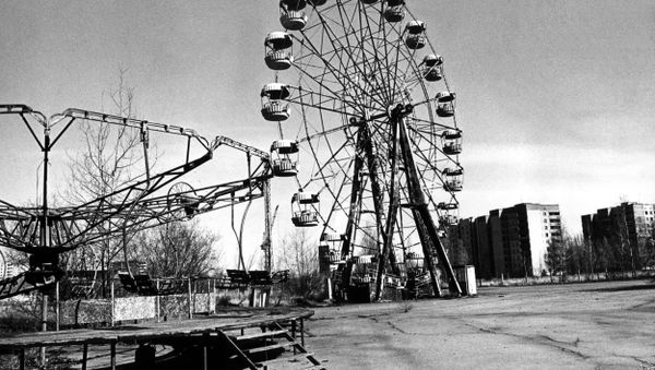 A picture dated 26 April 1996 for the 10th anniversary of the Chernobyl disaster, showing the ghost city of Pripyat. This attractions park has been once local children's favourite place of rest.  - Sputnik International