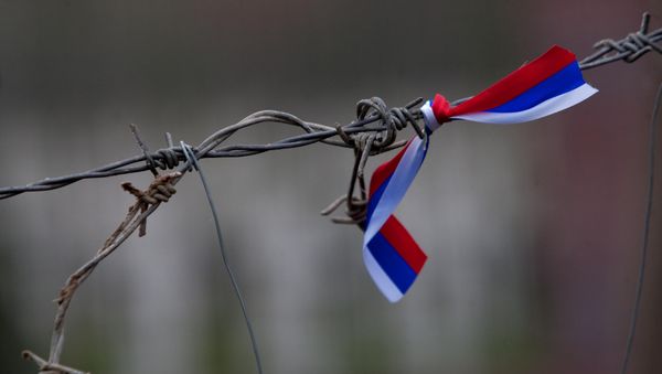 Barbed wire with a Russian flag Barbed wire with a Russian flag - Sputnik International