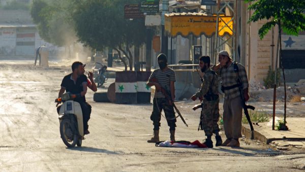 Terrorists from the Jund al-Aqsa group man a checkpoint in Taybat al Imam town after they advanced in the town in Hama province, Syria August 31, 2016 - Sputnik International