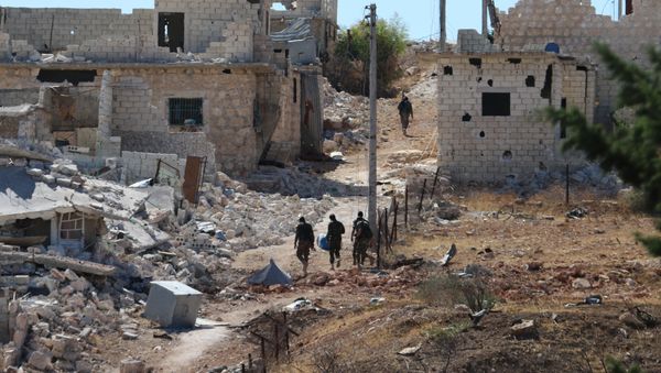 Syrian government forces walk amidst debris in the largely deserted Palestinian refugee camp of Handarat, north of Aleppo, on September 24, 2016 Syrian government forces walk amidst debris in the largely deserted Palestinian refugee camp of Handarat, north of Aleppo, on September 24, 2016 - Sputnik International
