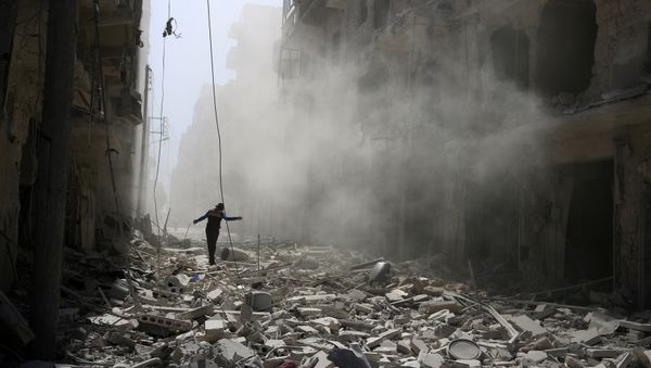 A man walks on the rubble of damaged buildings in Aleppo, Syria September 25, 2016 A man walks on the rubble of damaged buildings in Aleppo, Syria September 25, 2016 - Sputnik International