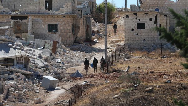 Syrian government forces walk amidst debris in the largely deserted Palestinian refugee camp of Handarat, north of Aleppo. (File) Syrian government forces walk amidst debris in the largely deserted Palestinian refugee camp of Handarat, north of Aleppo. (File) - Sputnik International