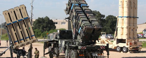 Israeli soldiers walk near an Israeli Irone Dome defence system (L), a surface-to-air missile (SAM) system, the MIM-104 Patriot (C), and an anti-ballistic missile the Arrow 3 (R) during Juniper Cobra's joint exercise press briefing at Hatzor Israeli Air Force Base in central Israel, on February 25, 2016. Juniper Cobra, is held every two years where Israel and the United States train their militaries together to prepare against possible ballistic missile attacks, as well as allowing the armies to learn to better work together. - Sputnik International