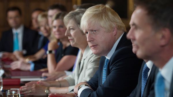 British Foreign Secretary Boris Johnson (2R) sits next to British Prime Minister Theresa May (3R) during a meeting of the cabinet at the Prime Minister's country retreat Chequers near the village of Ellesborough in Buckinghamshire, northwest of London, on August 31, 2016. British Foreign Secretary Boris Johnson (2R) sits next to British Prime Minister Theresa May (3R) during a meeting of the cabinet at the Prime Minister's country retreat Chequers near the village of Ellesborough in Buckinghamshire, northwest of London, on August 31, 2016. - Sputnik International