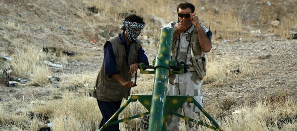 Rebel fighters prepare to launch homemade mortar rounds at Syrian army forces on in the northern Syrian city of Raqqa. Rebel fighters prepare to launch homemade mortar rounds at Syrian army forces on in the northern Syrian city of Raqqa. - Sputnik International
