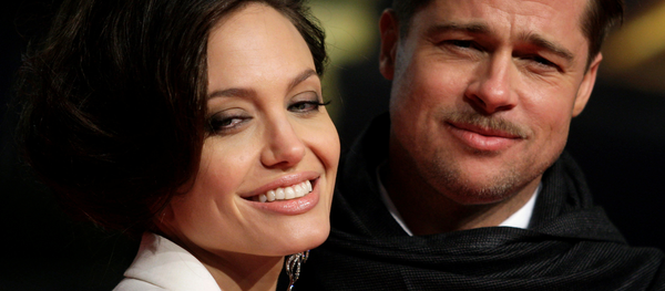 U.S. actors Brad Pitt and his partner Angelina Jolie pose for photographers on the red carpet at the German premiere of the movie The Curious Case of Benjamin Button in Berlin January 19, 2009. U.S. actors Brad Pitt and his partner Angelina Jolie pose for photographers on the red carpet at the German premiere of the movie The Curious Case of Benjamin Button in Berlin January 19, 2009. - Sputnik International