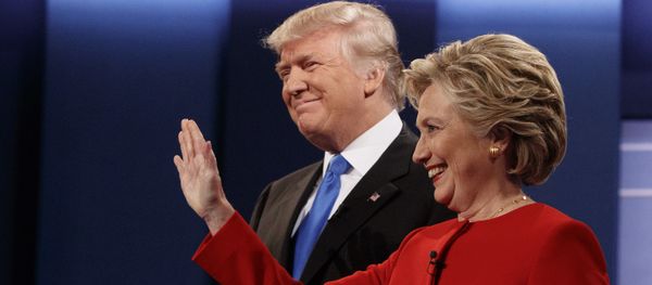 Republican presidential candidate Donald Trump, left, stands with Democratic presidential candidate Hillary Clinton before the first presidential debate at Hofstra University, Monday, Sept. 26, 2016, in Hempstead, N.Y. - Sputnik International