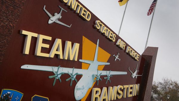 The German and the US flags fly at the entrance to the US Airbase in Ramstein, southern Germany - Sputnik International
