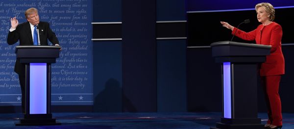 Republican nominee Donald Trump (L) looks on as Democratic nominee Hillary Clinton speaks during the first presidential debate at Hofstra University in Hempstead, New York Republican nominee Donald Trump (L) looks on as Democratic nominee Hillary Clinton speaks during the first presidential debate at Hofstra University in Hempstead, New York - Sputnik International