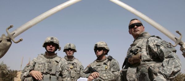 US soldiers stand near the landmark Hands of Victory, built by executed Iraqi president Saddam Hussein to commemorate Iraq's victory in the Iran-Iraq war, inside Baghdad's Green Zone as they prepare to go on a mission on July 5, 2008 US soldiers stand near the landmark Hands of Victory, built by executed Iraqi president Saddam Hussein to commemorate Iraq's victory in the Iran-Iraq war, inside Baghdad's Green Zone as they prepare to go on a mission on July 5, 2008 - Sputnik International