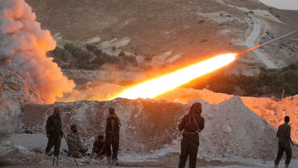 Free Syrian Army fighters launch a Grad rocket from Halfaya town in Hama province (File) - Sputnik International