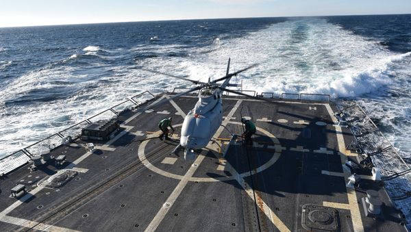The MQ-8C Fire Scout sits on the deck of the guided-missile destroyer, USS Jason Dunham (DDG 109) (File) The MQ-8C Fire Scout sits on the deck of the guided-missile destroyer, USS Jason Dunham (DDG 109) (File) - Sputnik International