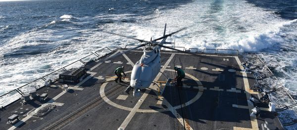 The MQ-8C Fire Scout sits on the deck of the guided-missile destroyer, USS Jason Dunham (DDG 109) (File) The MQ-8C Fire Scout sits on the deck of the guided-missile destroyer, USS Jason Dunham (DDG 109) (File) - Sputnik International
