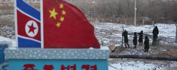 North Korean and Chinese national flags (File) - Sputnik International