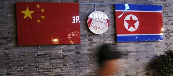 Chinese and  North Korean national flags (File) - Sputnik International