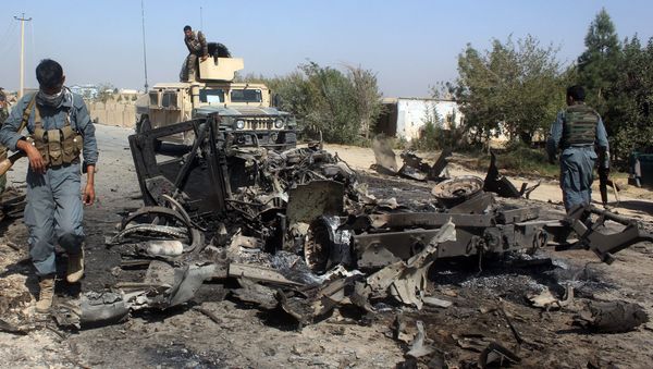 Afghan security forces inspect the site of a U.S. airstrike in Kunduz city, north of Kabul, Afghanistan (File) - Sputnik International
