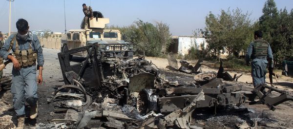 Afghan security forces inspect the site of a U.S. airstrike in Kunduz city, north of Kabul, Afghanistan (File) - Sputnik International