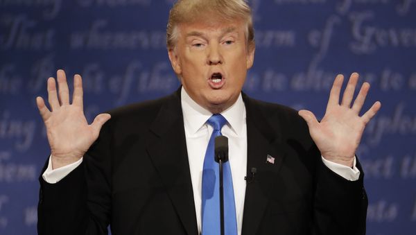 Republican presidential nominee Donald Trump speaks to Democratic presidential nominee Hillary Clinton during the presidential debate at Hofstra University in Hempstead, N.Y., Monday, Sept. 26, 2016. - Sputnik International