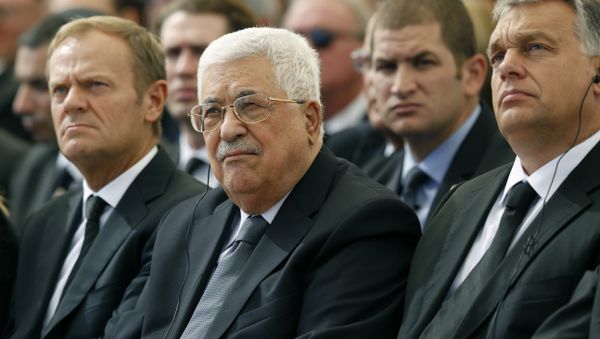 Palestinian president Mahmud Abbas (C) sits alongside European Council President Donald Tusk (L) and Romanian President Klaus Iohannis at Jerusalem's Mount Herzl national cemetery during the funeral of former Israeli president Shimon Peres on September 30, 2016 - Sputnik International