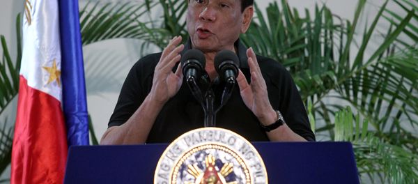 Philippines President Rodrigo Duterte gestures during a news conference upon his arrival from a state visit in Vietnam at the International Airport in Davao city, Philippines September 30, 2016. - Sputnik International