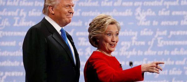 Republican US presidential nominee Donald Trump and Democratic U.S. presidential nominee Hillary Clinton look on at the start of their first presidential debate at Hofstra University in Hempstead, New York, US, September 26, 2016. - Sputnik International