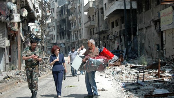 Syrians residents of Homs return to the old town of Syria's central city (File) Syrians residents of Homs return to the old town of Syria's central city (File) - Sputnik International